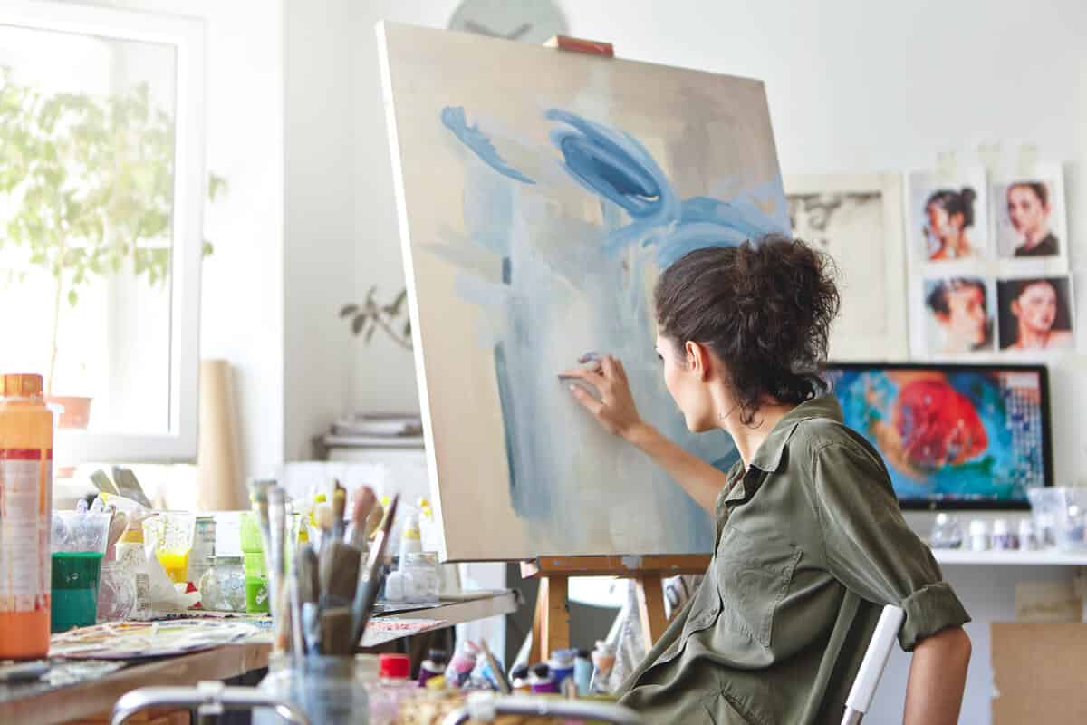 Woman painting Happier Hobbies With Self Storage