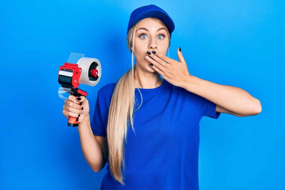 Woman with Tape Self Storage Home Organization