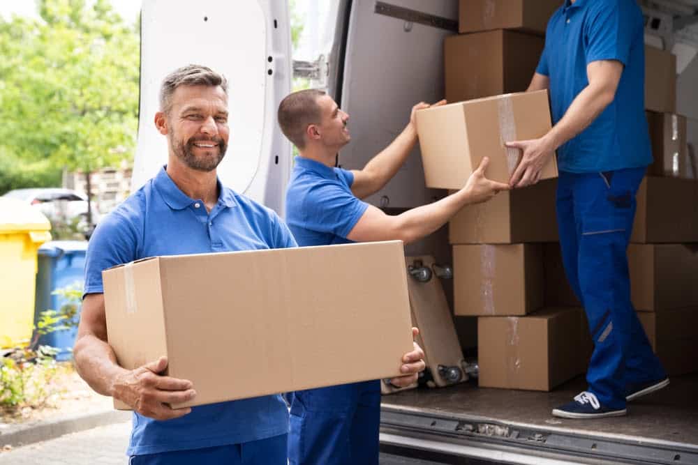 Truck Movers Loading Van Carrying Boxes And Moving House