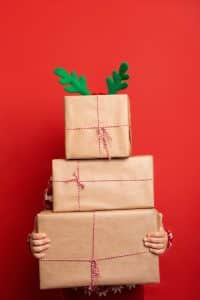 Woman holding boxes and presents